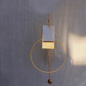 Single large hoop gold earring with ear clip